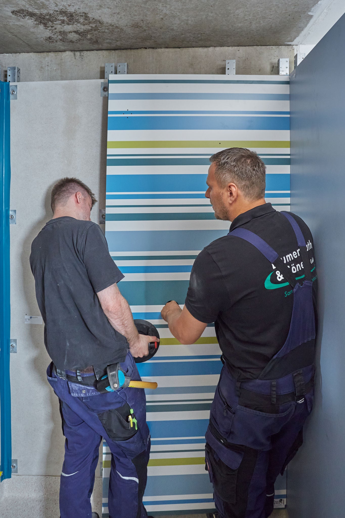 Installation of shower wall in student residence