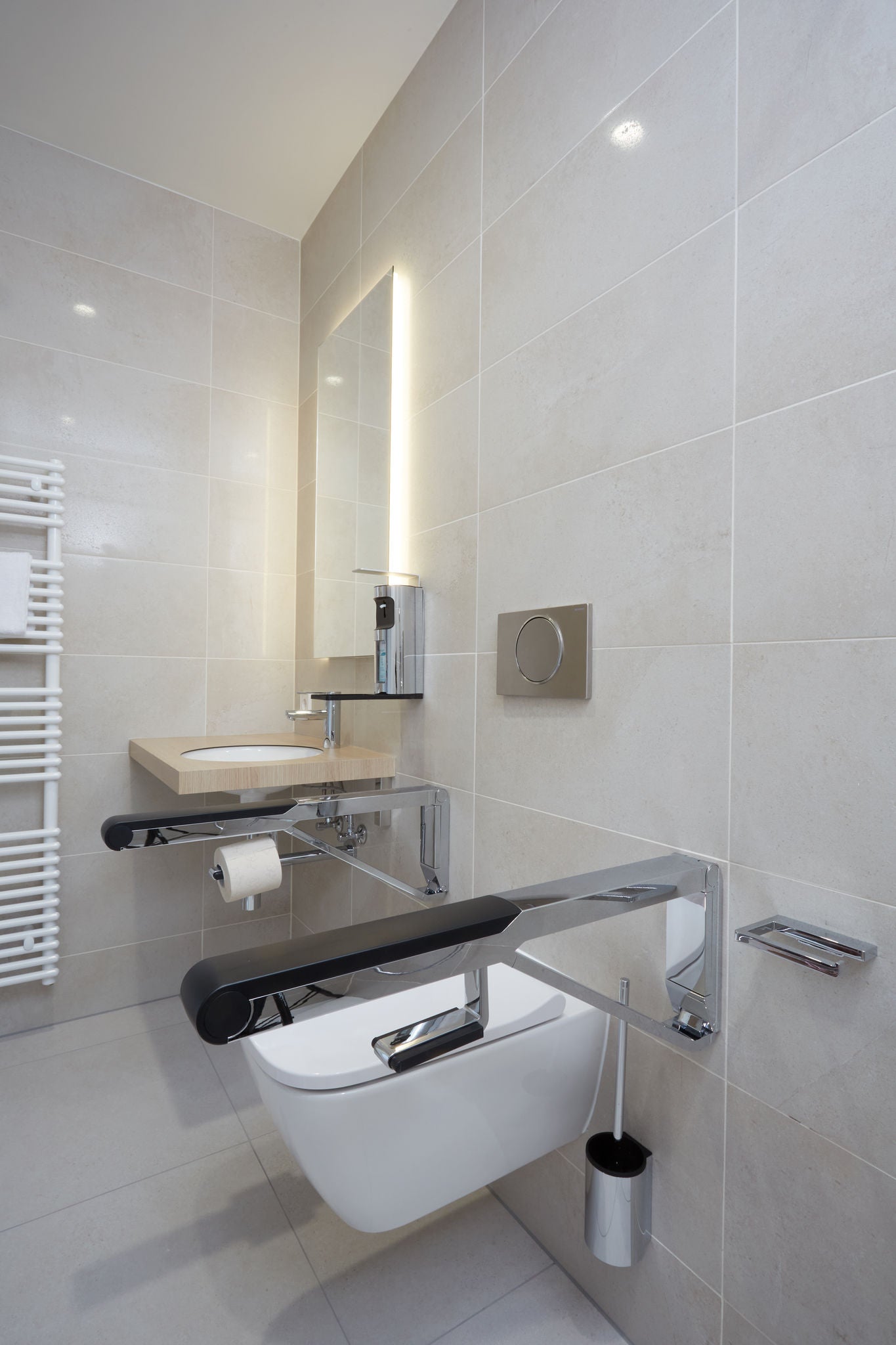 Toilet at Eisenberg Rehabilitation Clinic with PLAN accessories and AXESS drop down supporting rail, chrome-plated