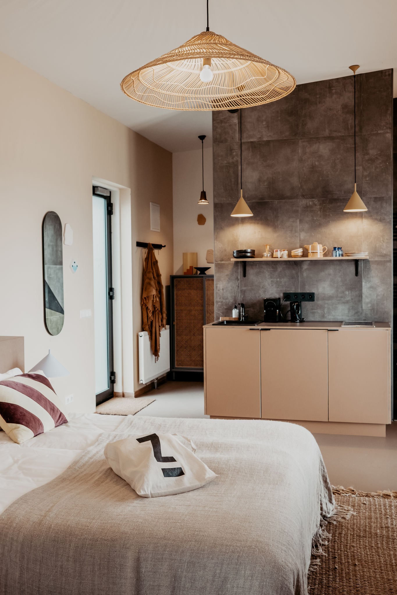 Bed and kitchenette in the Zoomers Hotel with EDITION 400 black chrome fittings